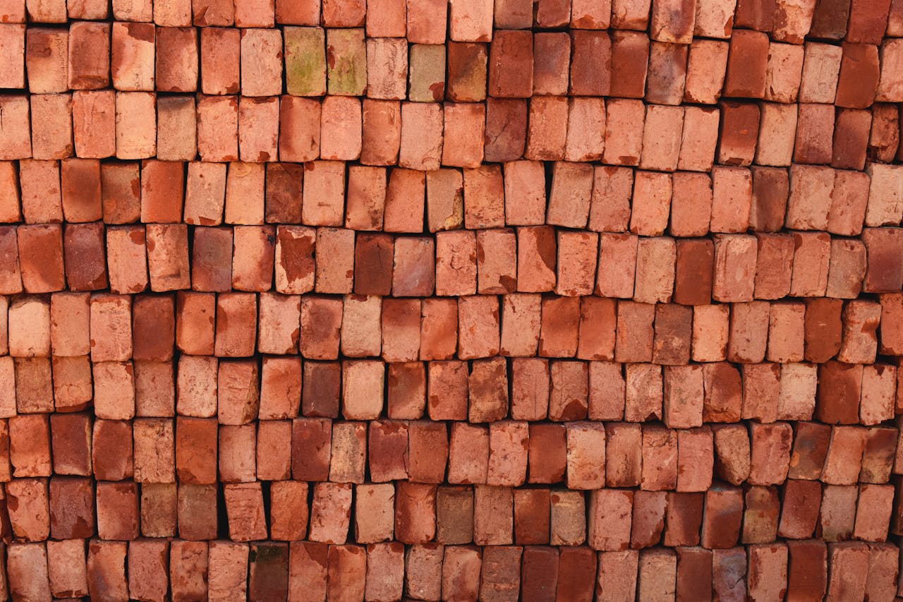 Close-up view of red bricks stacked neatly in Bangladesh, ideal for construction themes.